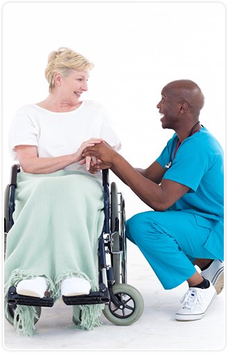 Older woman being comforted by male nurse